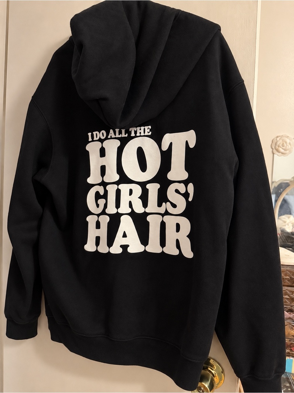 Black Graphic Hoodie - 'I Do All The Hot Girls' Hair'